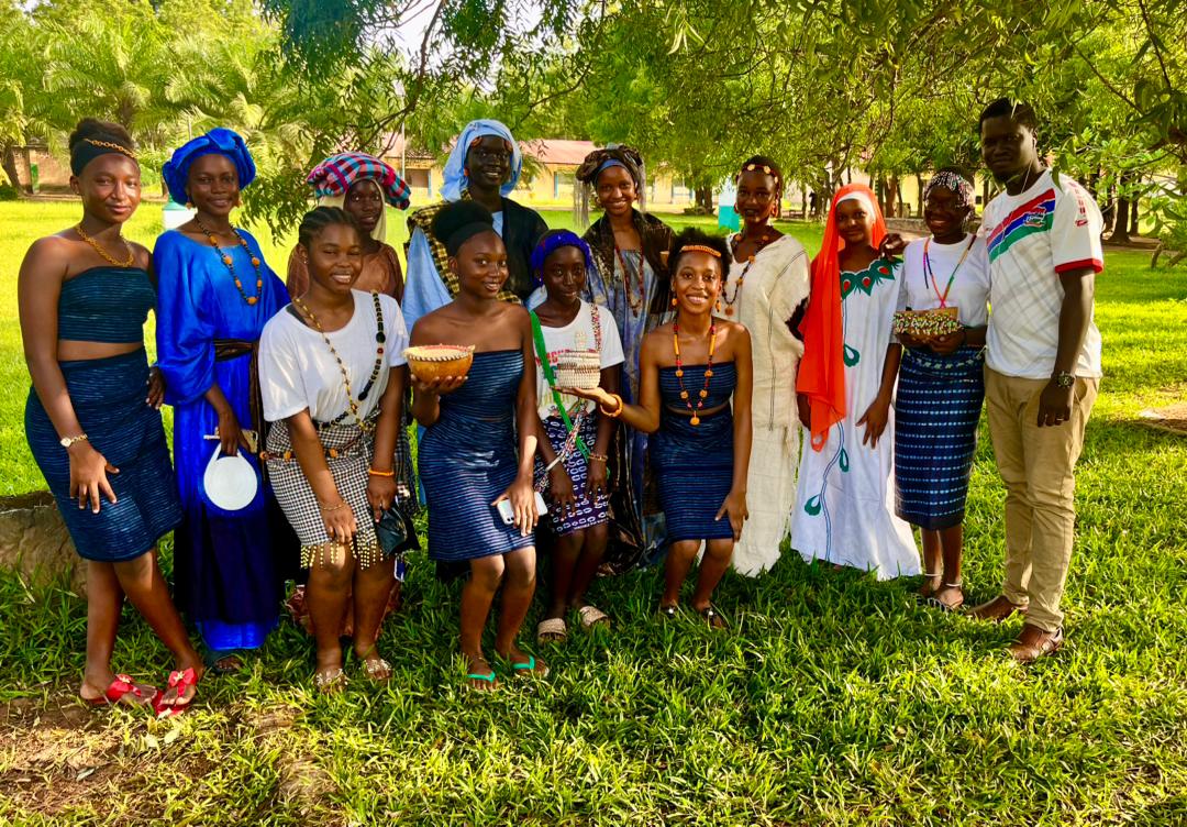 A group on the St. Peter's campus wearing traditional clothing
